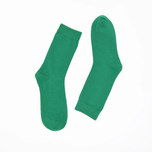 Pair of green socks on a white background