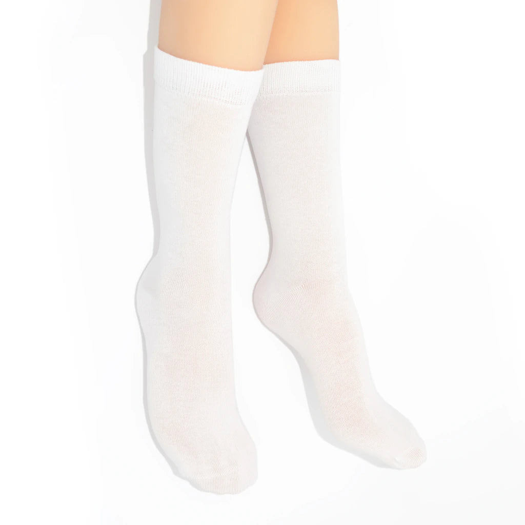 Legs modelling white socks on a white background