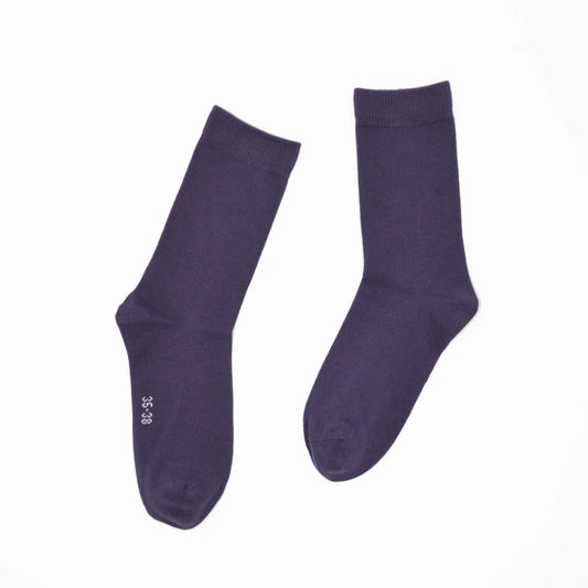Pair of purple socks on a white background