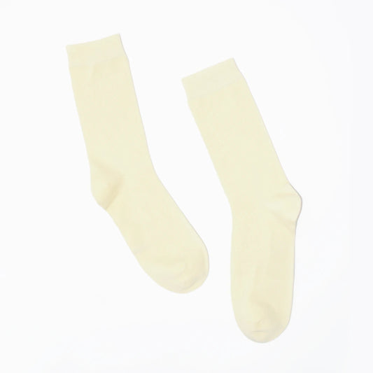 Pair of cream-colored socks on a white background