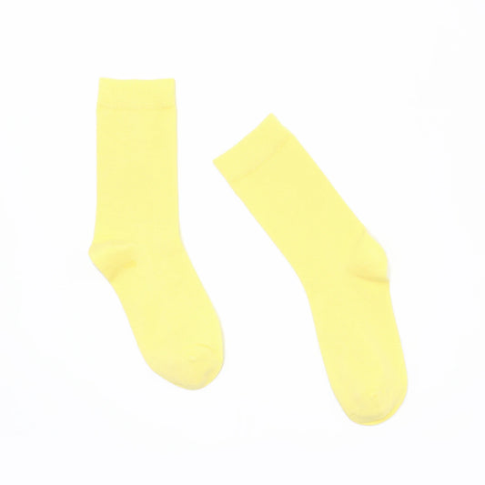Pair of yellow socks on a white background