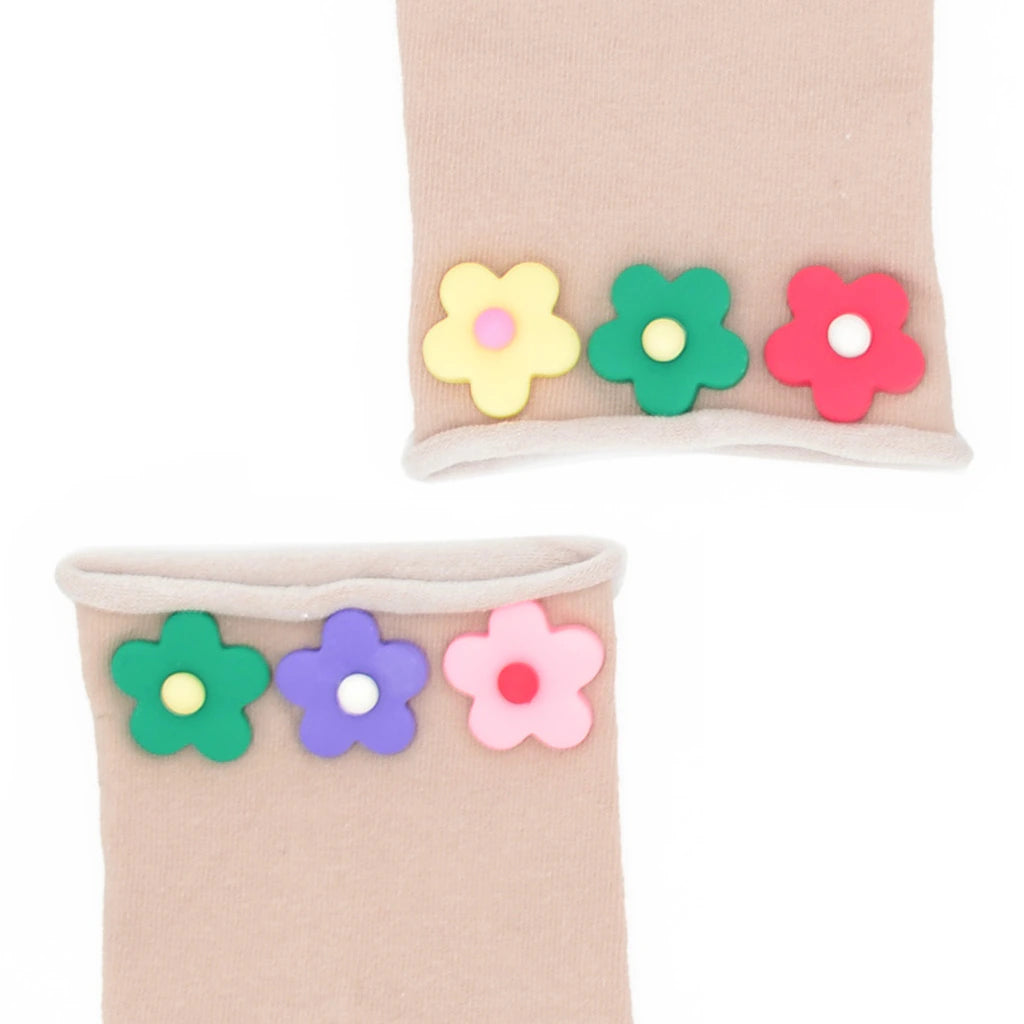 Beige socks with colorful flower appliqués on a white background