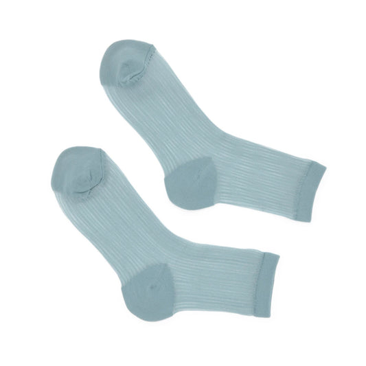 Pair of light blue socks on a white background
