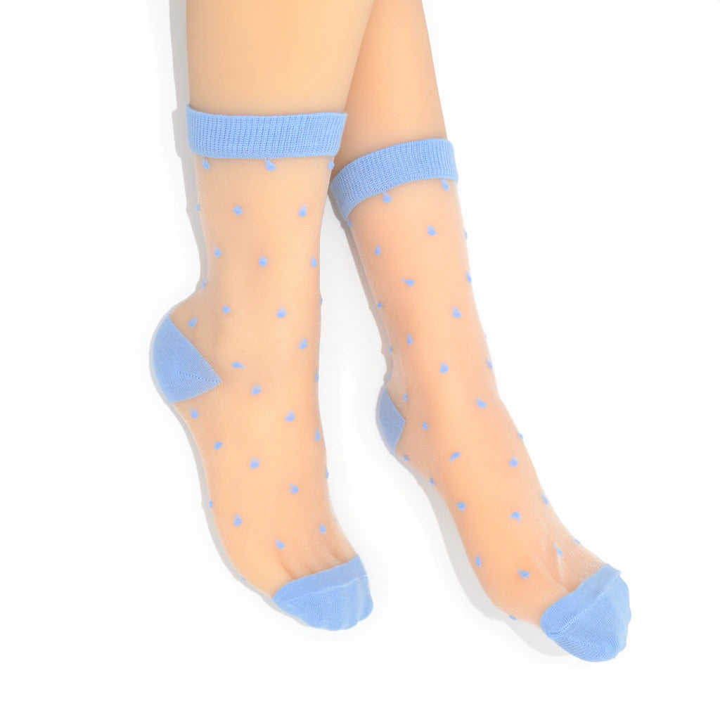 Sheer socks with blue polka dots and cuffs on a white background