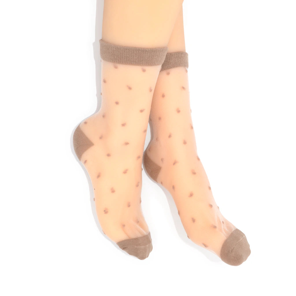 Sheer beige socks with brown toes and cuffs on a white background