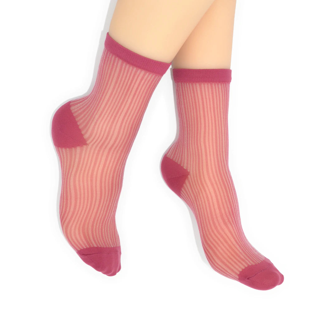 Sheer socks with pink top and toe on a white background