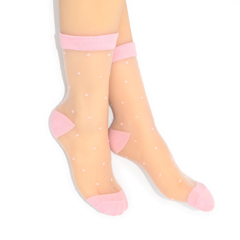 Sheer socks with pink polka dots on a white background
