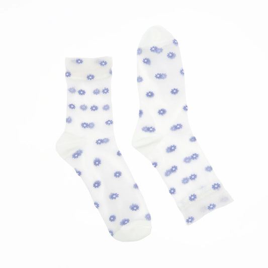 A pair of white crew socks with a small blue daisy pattern, displayed against a solid white background.
