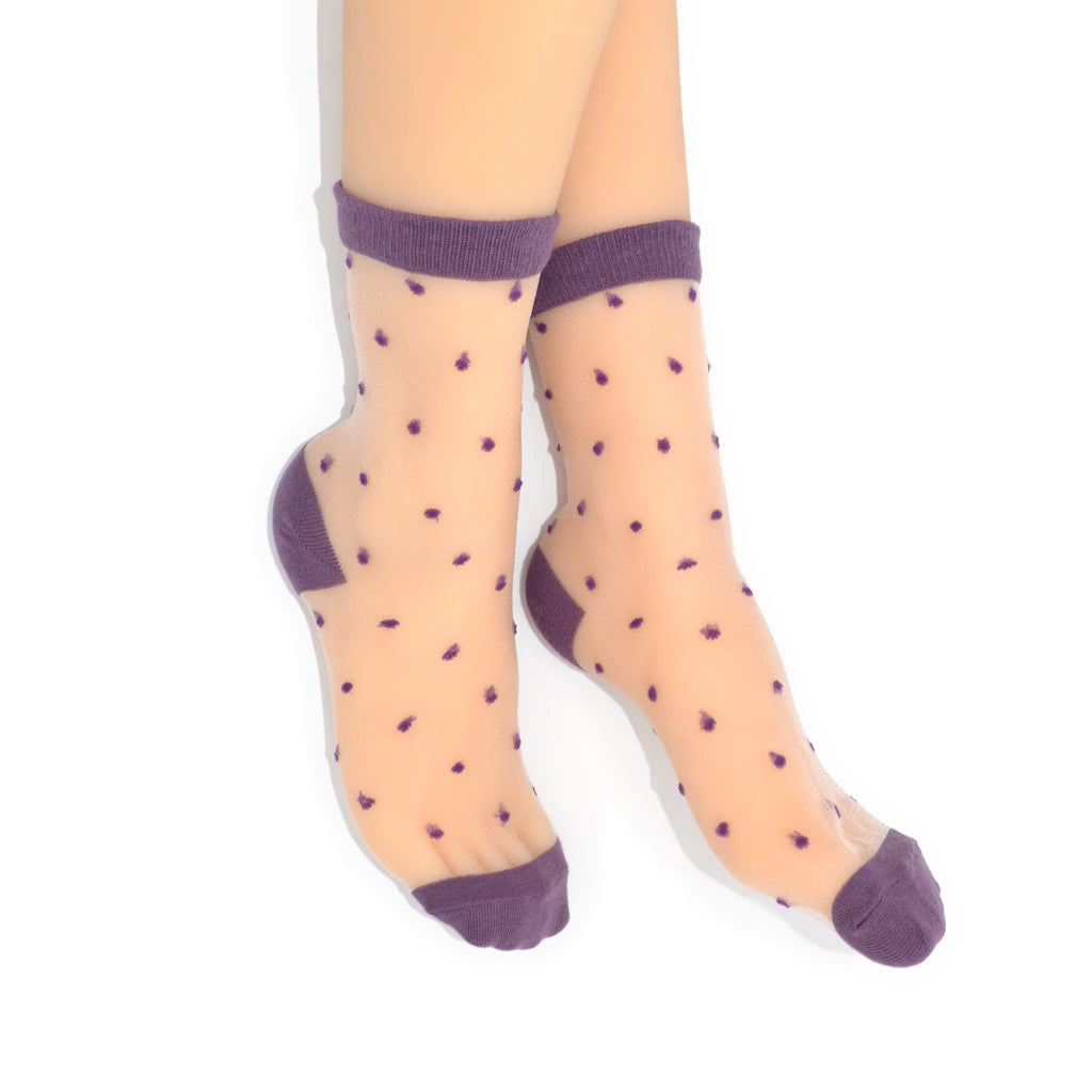Sheer socks with purple dot pattern and cuffs on a white background