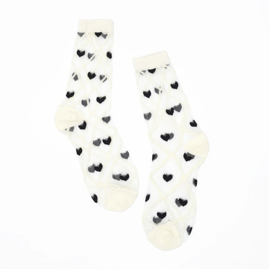 a pair of sheer mesh socks with black heart and white criss cross pattern