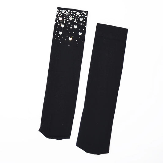 Black socks with heart crystals on a white background