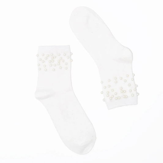 White ankle socks with pearl embellishments on a white background