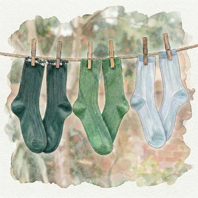 Watercolour illustration of socks hanging on a clothes line