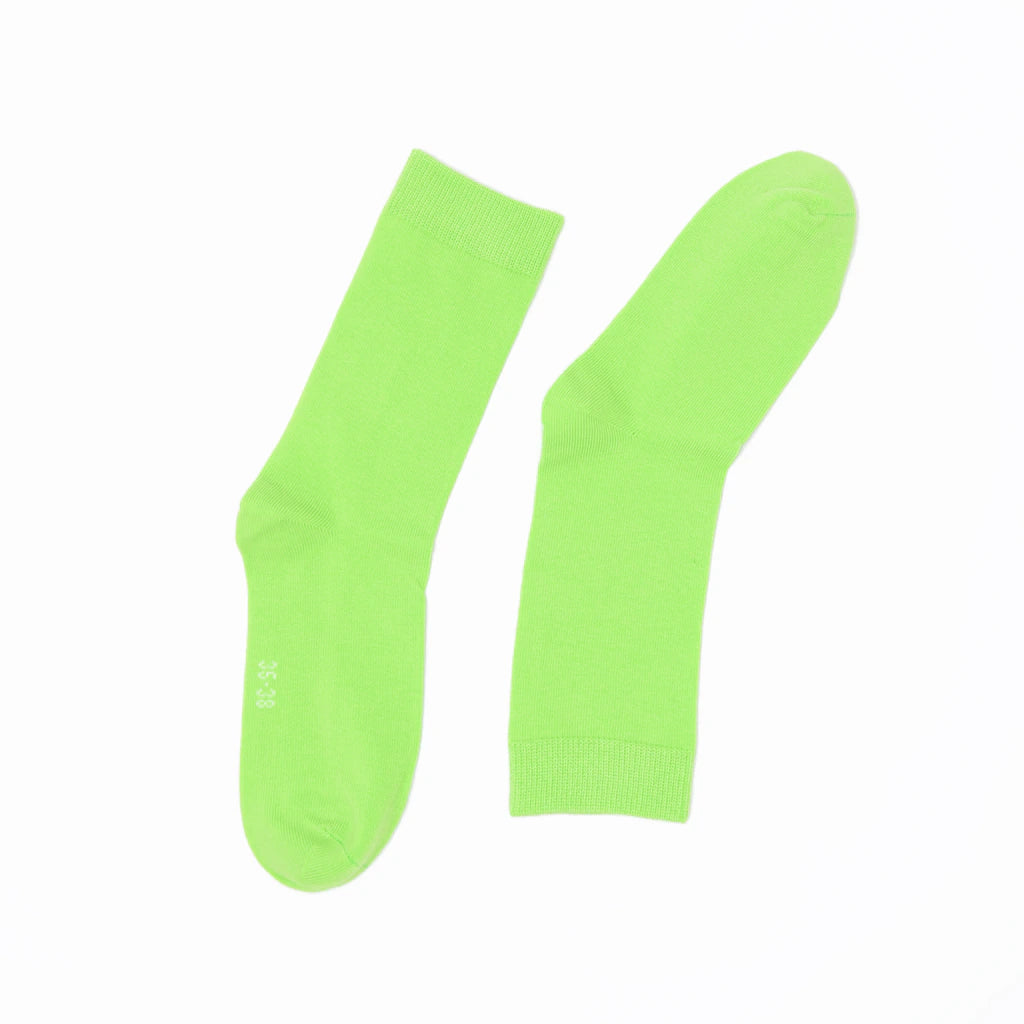 Pair of bright green socks on a white background