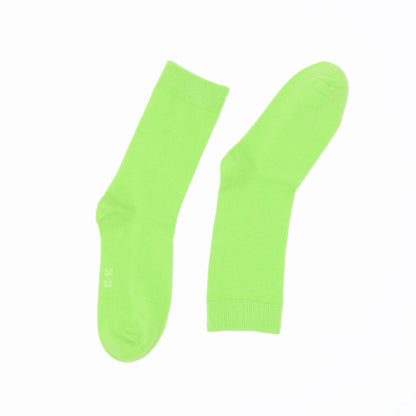 Pair of bright green socks on a white background