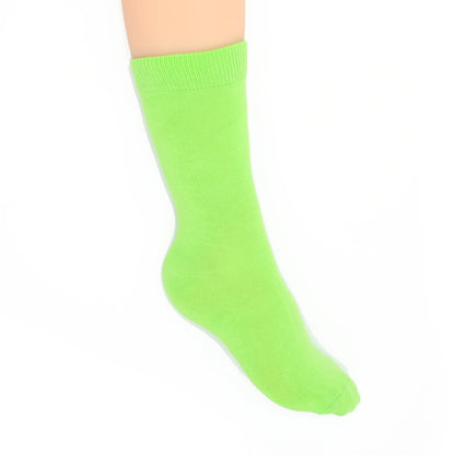 Leg modelling bright green socks on a white background