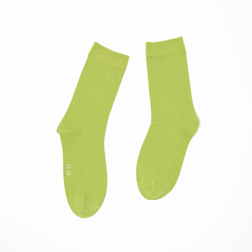 Pair of green socks on a white background