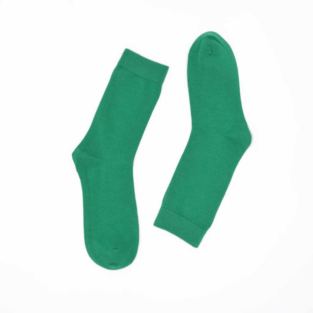 Pair of green socks on a white background