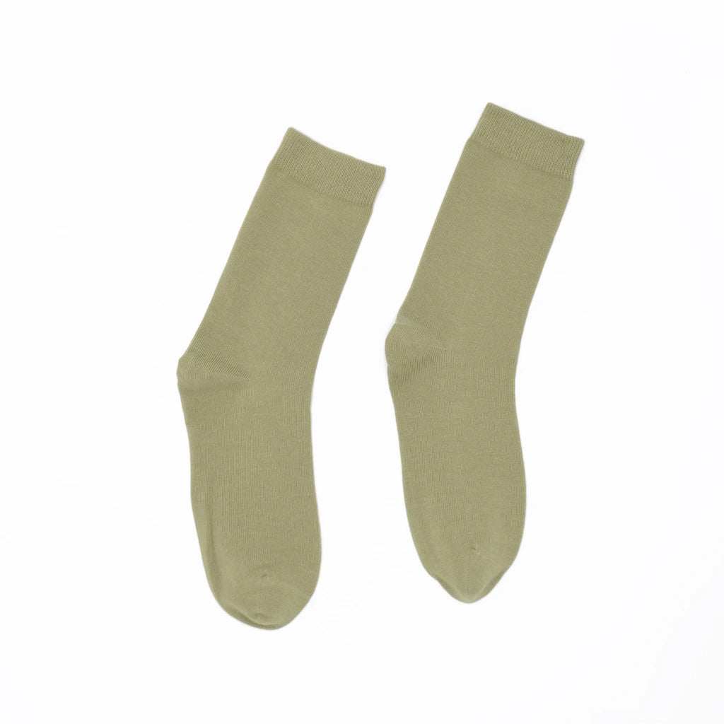 Pair of green socks on a white background