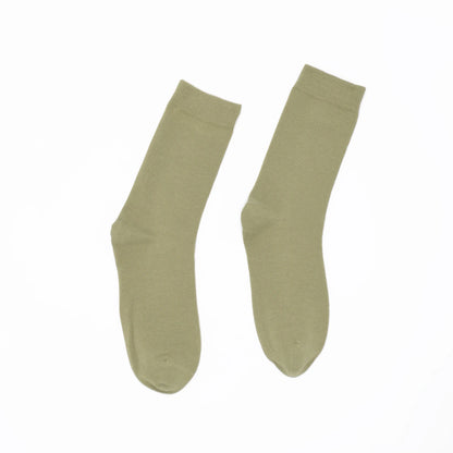Pair of green socks on a white background