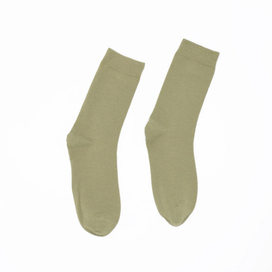 Pair of green socks on a white background