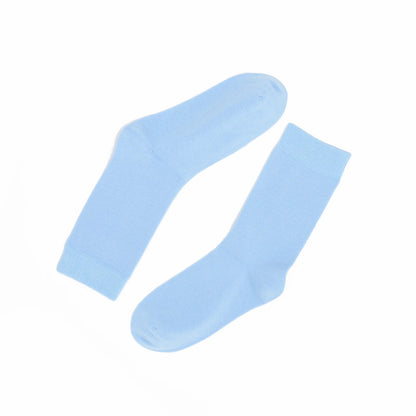Pair of light blue socks on a white background