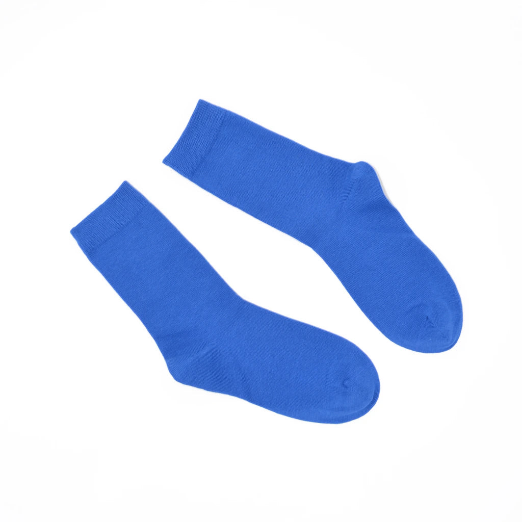 Pair of cobalt blue socks on a white background