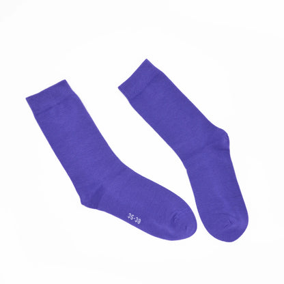 Pair of purple socks on a white background