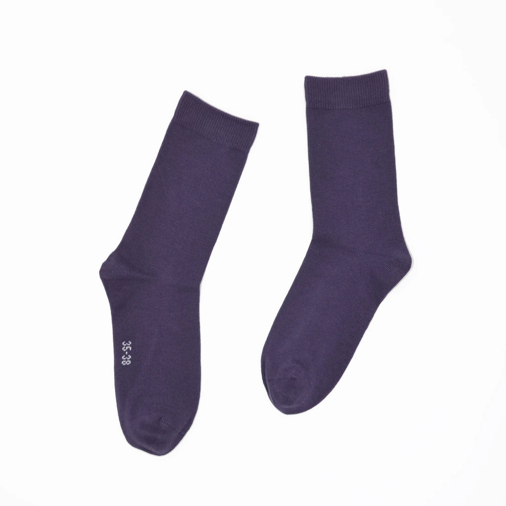 Pair of purple socks on a white background
