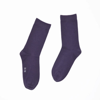 Pair of purple socks on a white background
