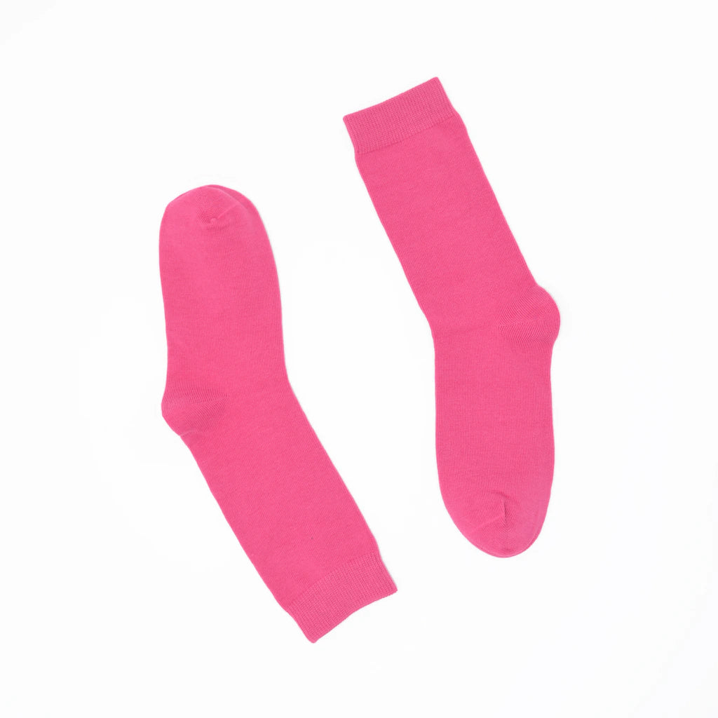 Pair of bright pink socks on a white background