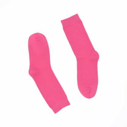 Pair of bright pink socks on a white background