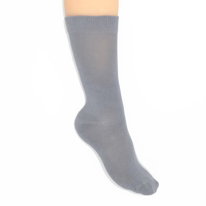 Leg modelling gray socks on a white background