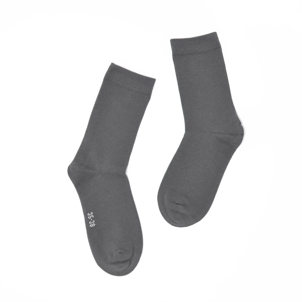 Pair of gray socks on a white background