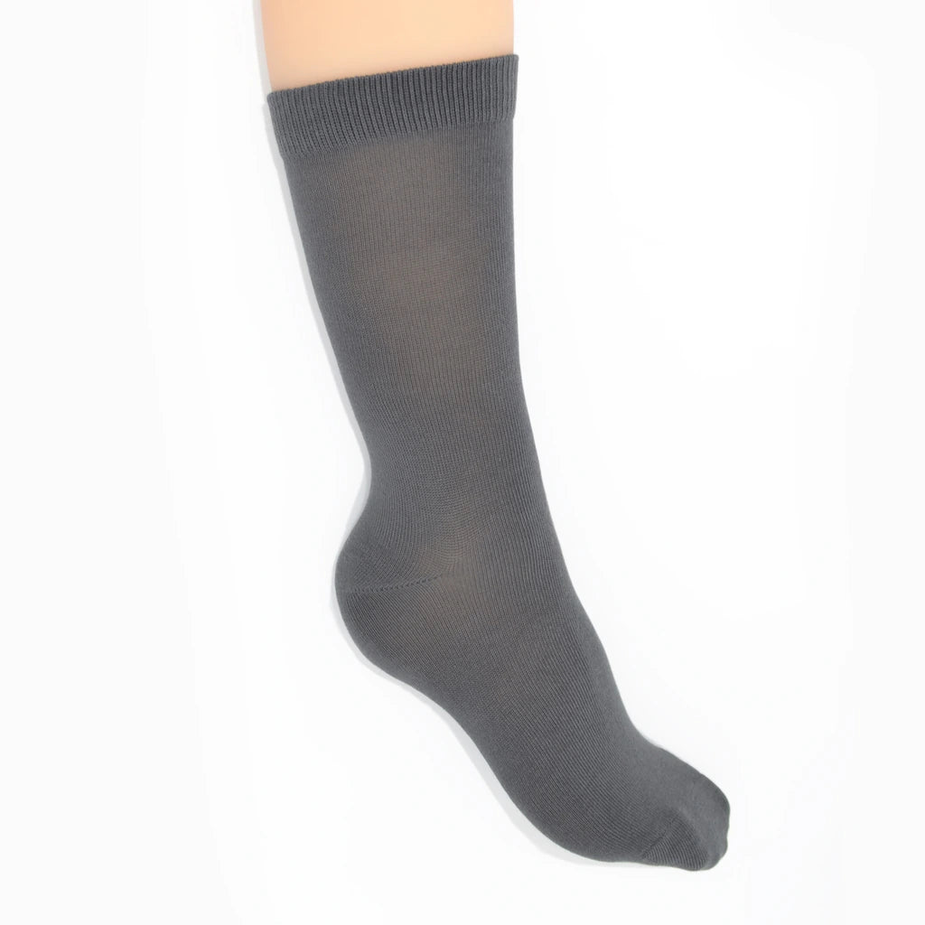 Leg modelling gray socks on a white background