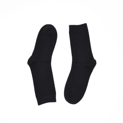 Two black socks on a white background