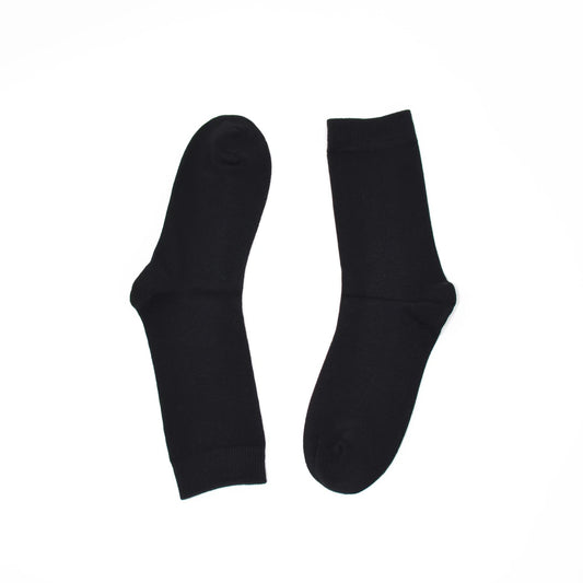 Two black socks on a white background