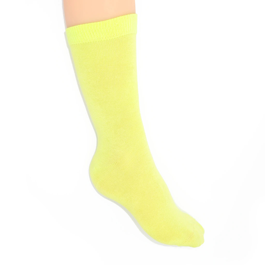 Leg modelling chartreuse socks on a white background