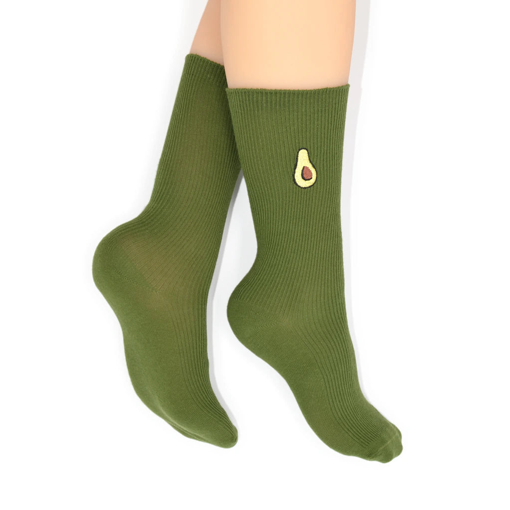 Green socks with an avocado design on a white background