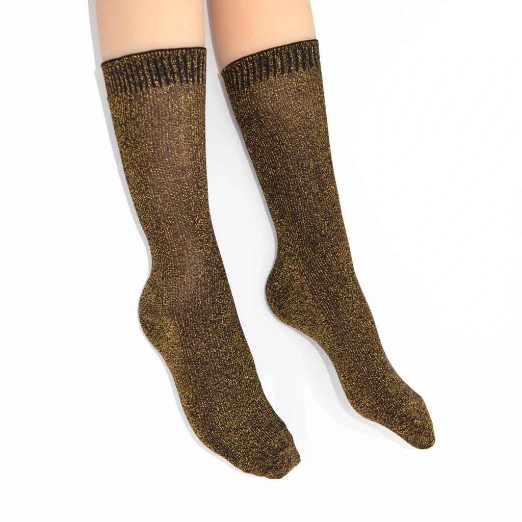 Brown socks worn by a person on a white background