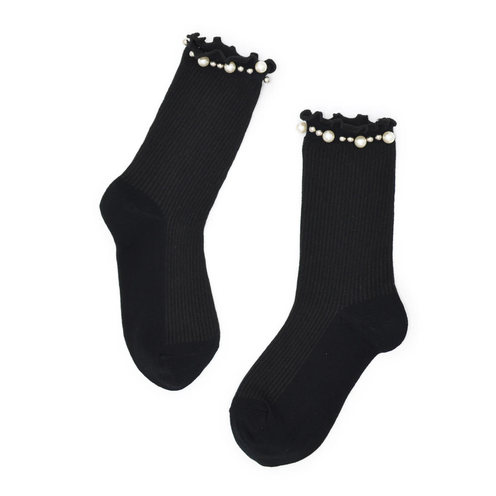 Black socks with pearl embellishments on a white background