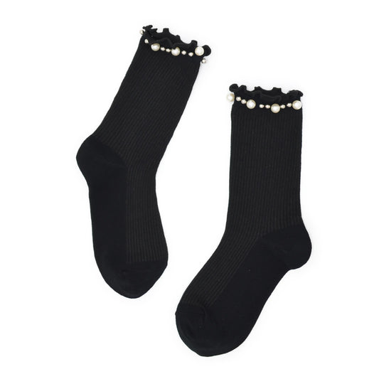 Black socks with pearl embellishments on a white background