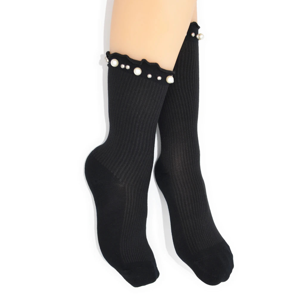 Black socks with pearl details on a white background