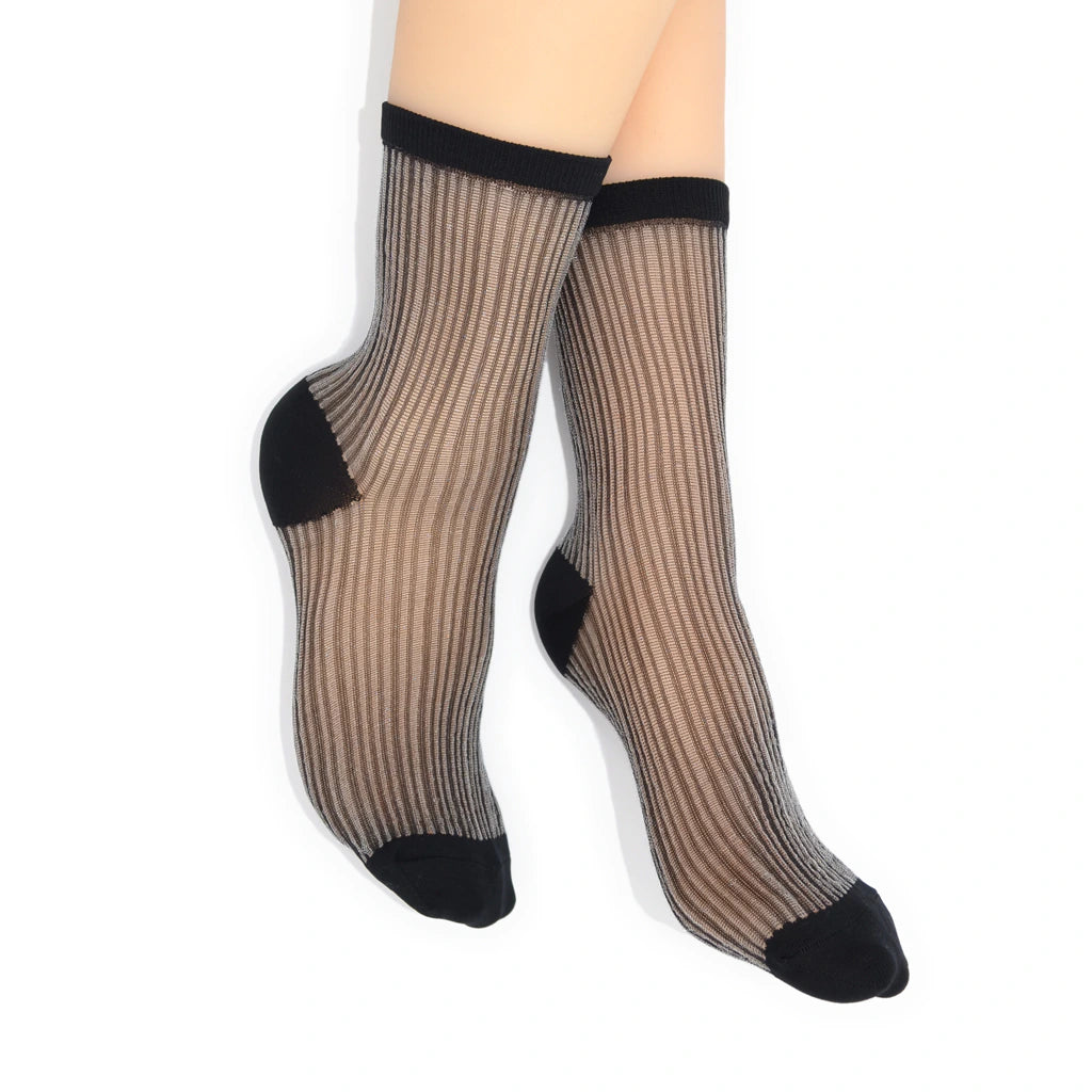 Sheer black striped socks with black toes and cuffs on a white background