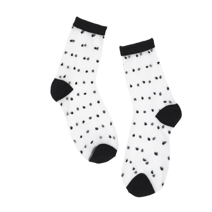 Black sheer socks with black dots and cuffs on a white background