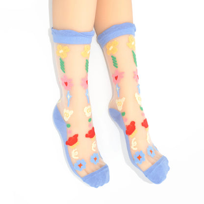 Sheer socks with colorful heart and flower patterns on a white background
