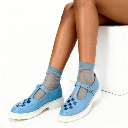 model wearing blue sheer line socks and bright blue t bar shoes