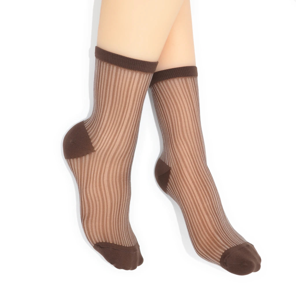 Sheer brown socks with brown accents on a white background