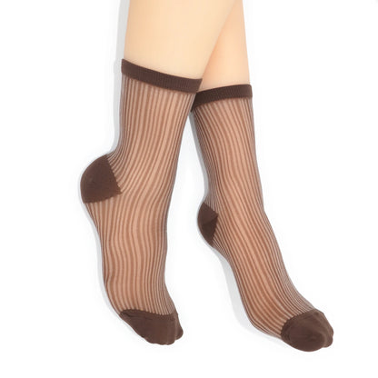 Sheer brown socks with brown accents on a white background