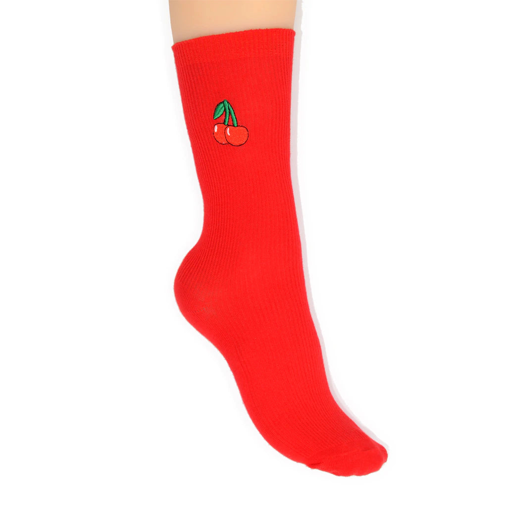 Red sock with a cherry design on a white background